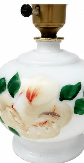 Vintage milk glass lamp with  plastic shade holder.