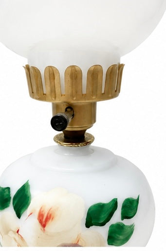 Vintage milk glass lamp with  plastic shade holder.